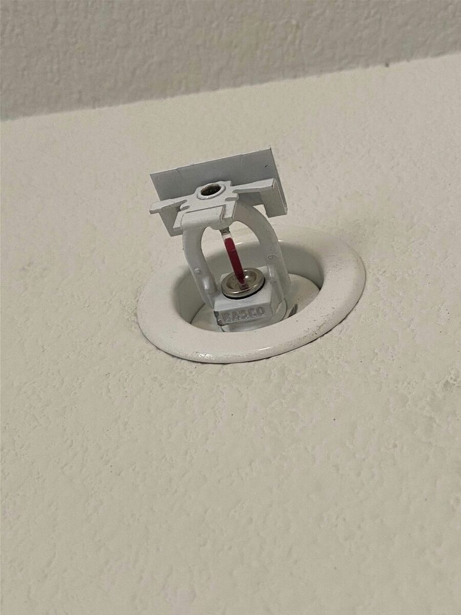 Newly installed unpainted fire sprinkler head, ready to operate at its listed activation temperature