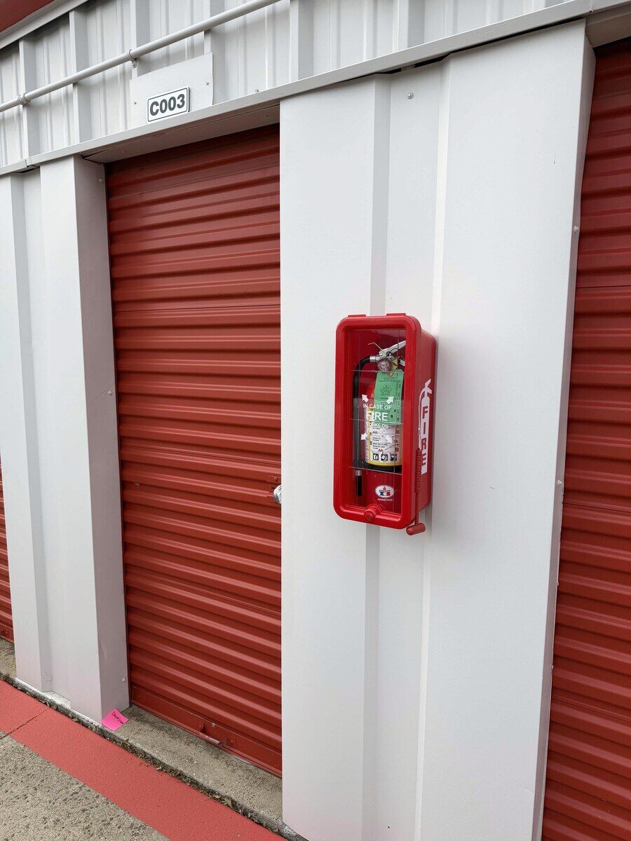 Fully tagged extinguishers and cabinets installed and documented per NFPA 10 across a commercial facility