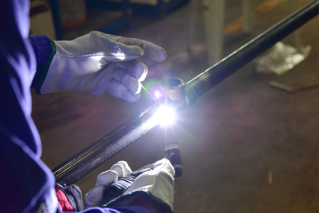 Paragon technician performing preventative maintenance on a riser