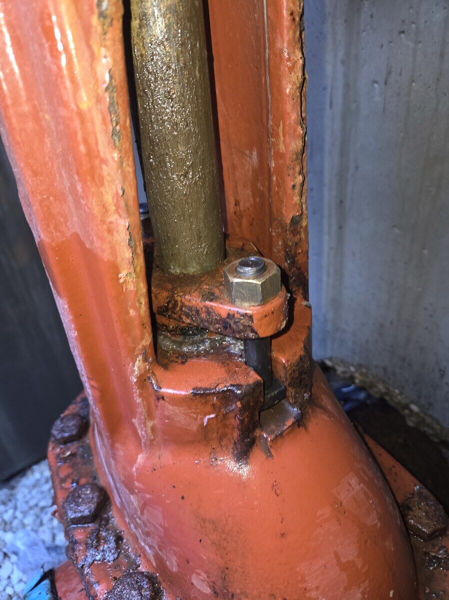 After: Backflow — damaged packing and corroded bolts (assembly compromised) → relubricated, new bolts, ready for follow-up TCEQ retest.