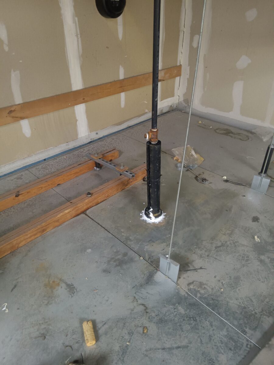 On top of the walk-in freezer box, the insulated pipe drop that feeds the dry pendent below