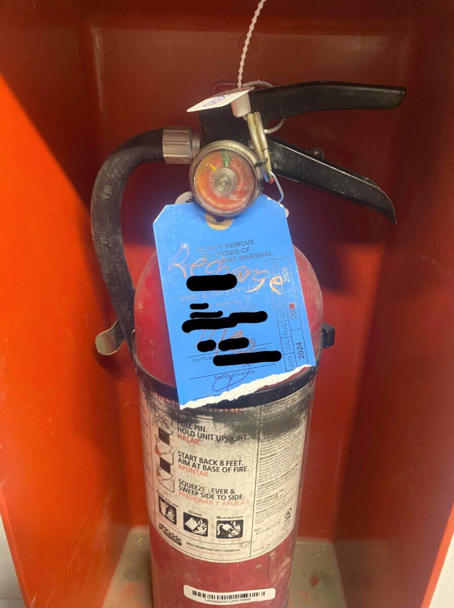 Before: Extinguisher — gauge below the green band at annual visual → recharged, weighed, sealed, and re-tagged at the Paragon shop.