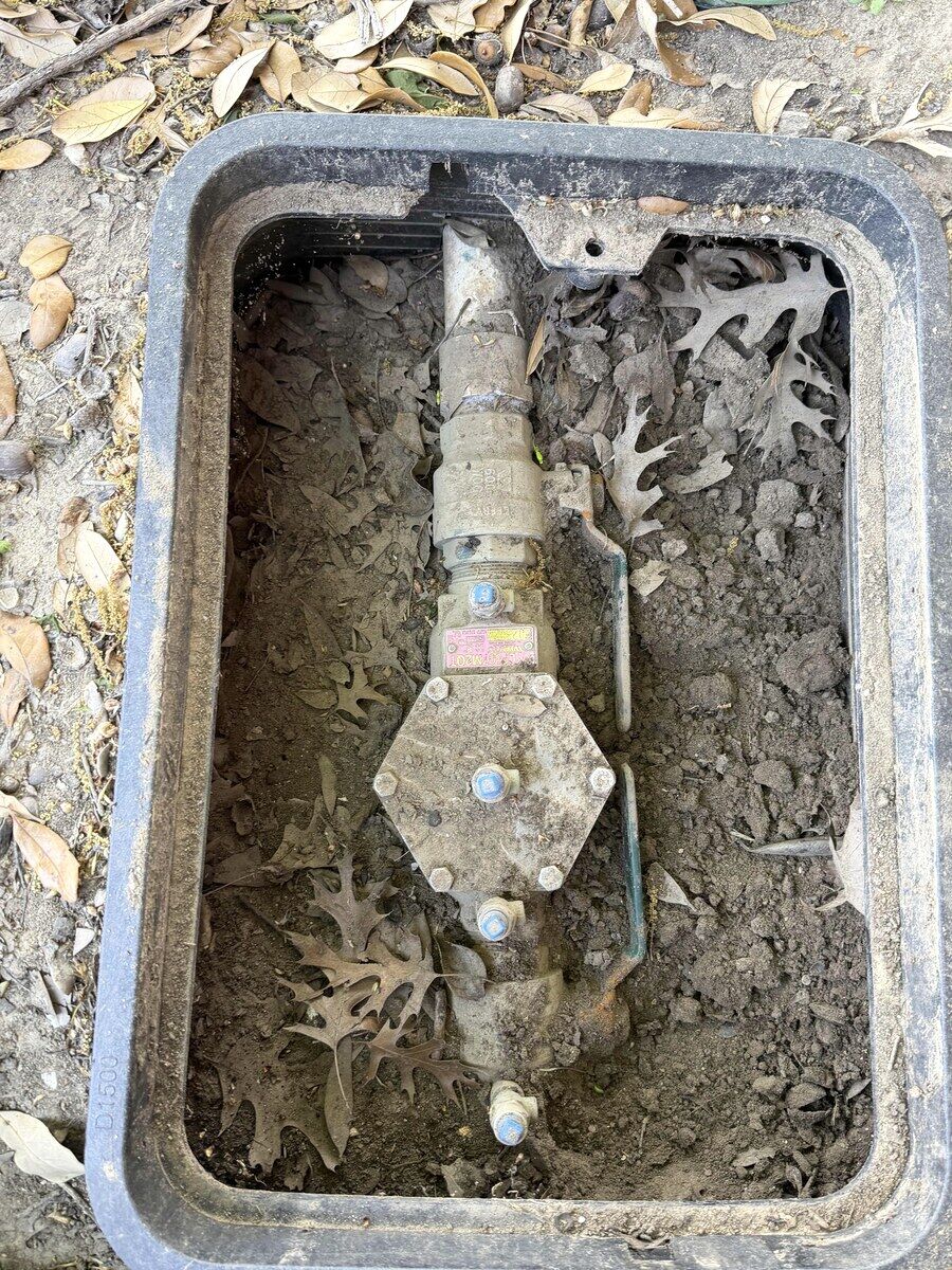 Before: Backflow assembly — failed differential at annual test → rebuilt internals, passing retest with a TCEQ-compliant report on file.