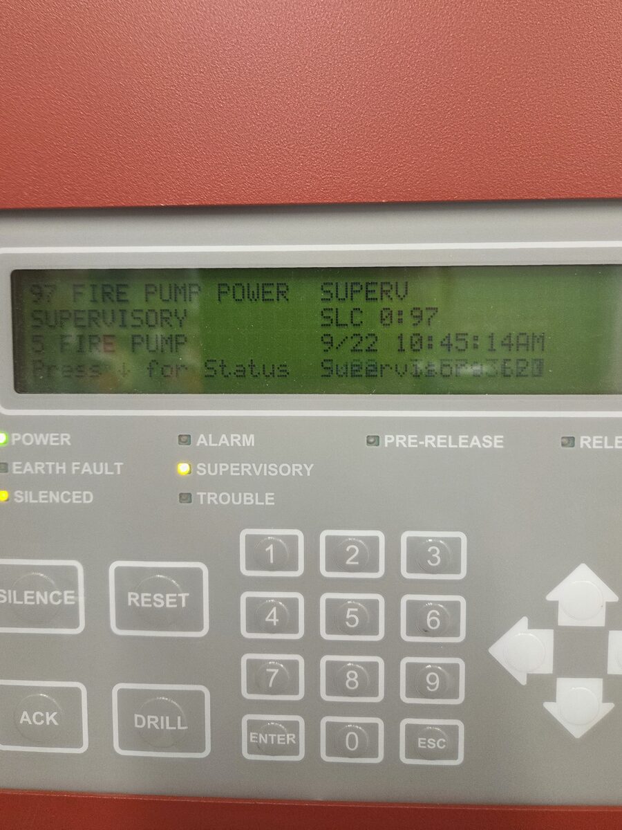 Fire alarm panel display showing a fire pump power supervisory signal