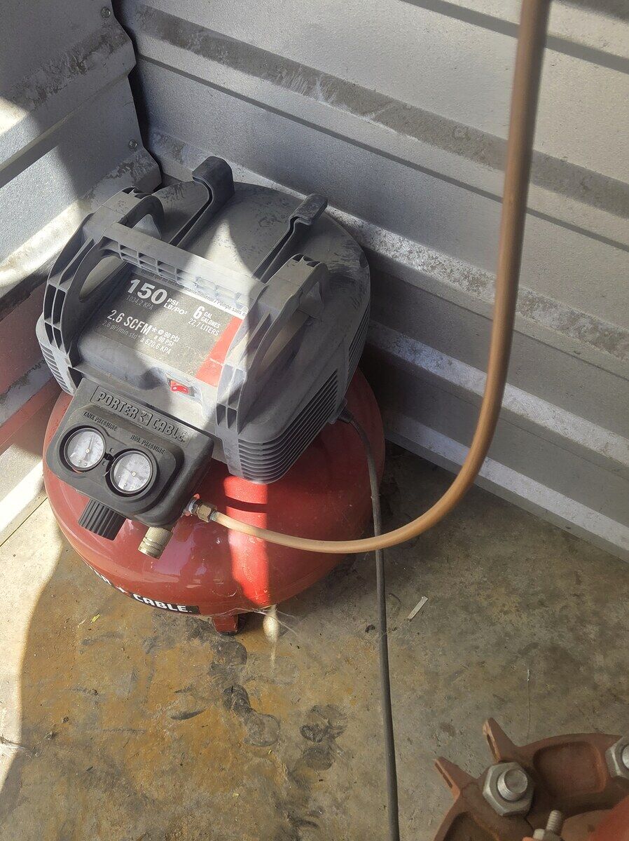 Before: dry sprinkler system running off an unlisted, rigged compressor — out of compliance with NFPA 13 and the Irving AHJ