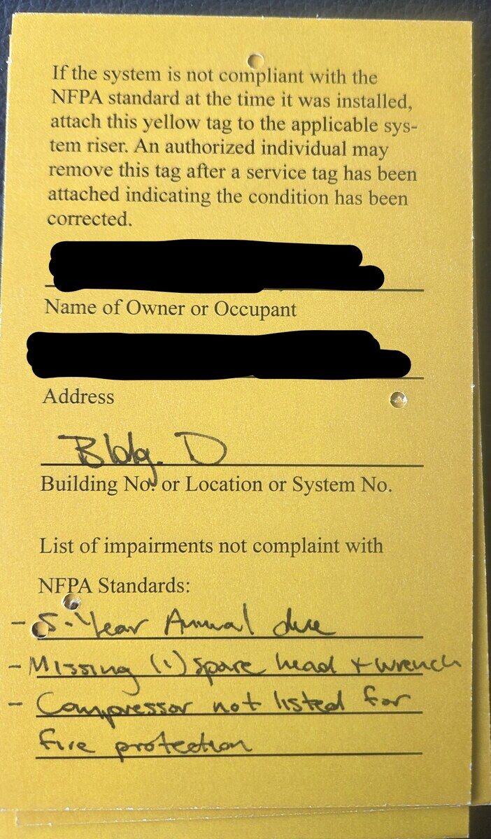 Before: yellow inspection tag — deficient, system out of compliance with the Irving AHJ