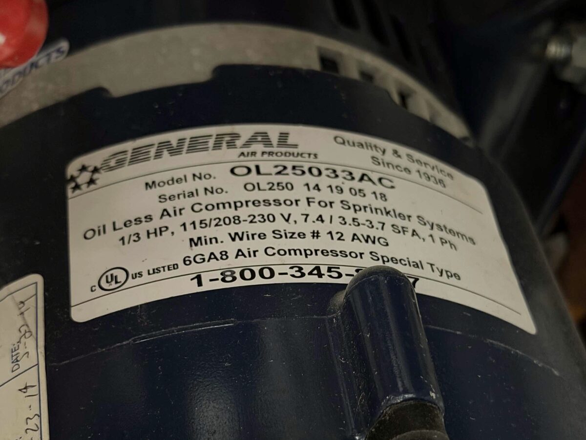 Compressor nameplate — a 1/3 HP oil-less air compressor rated for sprinkler systems, the spec Paragon matched like-for-like