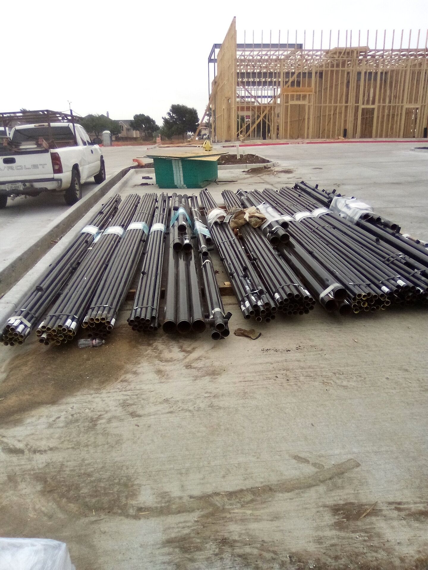 Sprinkler pipe staged at the Stonebrook shell-building site