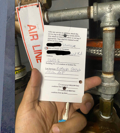 Service tag documenting the repair — system, parts, date, technician